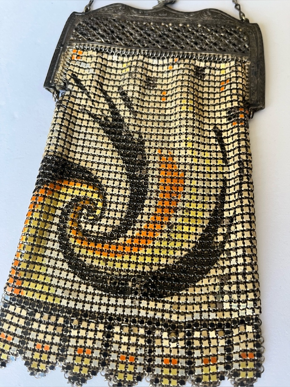 Art Nouveau enamel metal mesh evening bag with swirl design.